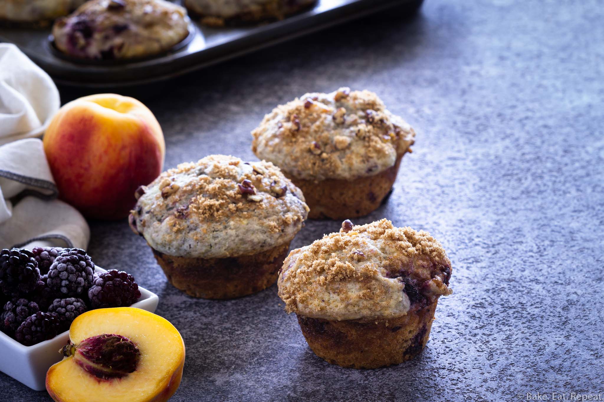 Blackberry Peach Coffee Cake Muffins - Bake. Eat. Repeat.