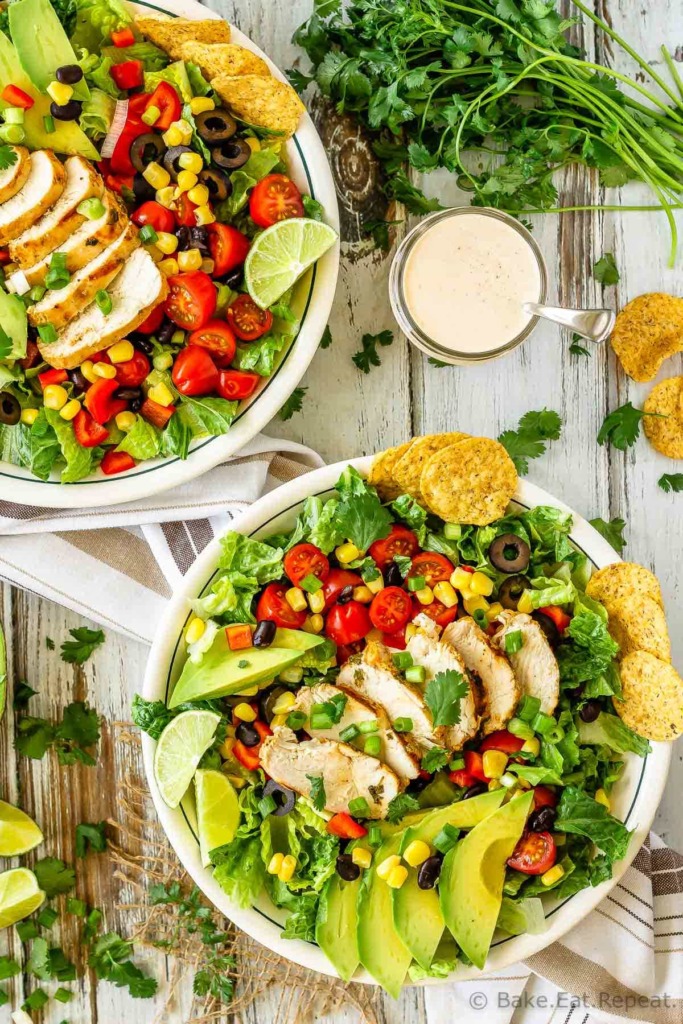 This chicken taco salad is one of our favourite meals - juicy, grilled cilantro lime chicken tossed with salad, tortilla chips and tasty taco ranch dressing!