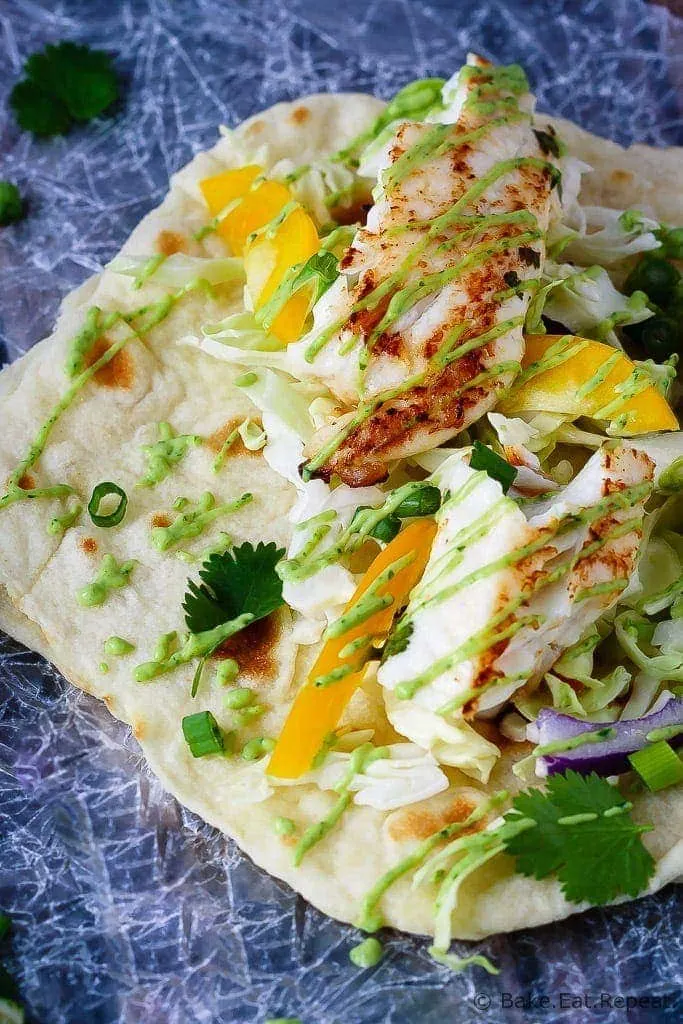 Fish Tacos with Avocado Cream - A perfect 20 minute meal when you want something healthy that everyone will love - these fish tacos with avocado cream are fantastic!