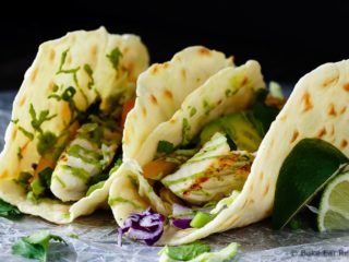 Fish Tacos with Avocado Cream - A perfect 20 minute meal when you want something healthy that everyone will love - these fish tacos with avocado cream are fantastic!