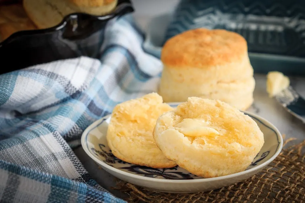 These homemade cream biscuits use only 4 ingredients, take just minutes to mix up, and result in wonderfully flaky homemade biscuits you will love! The perfect easy side dish for any meal, or even for breakfast warmed up with some jam!