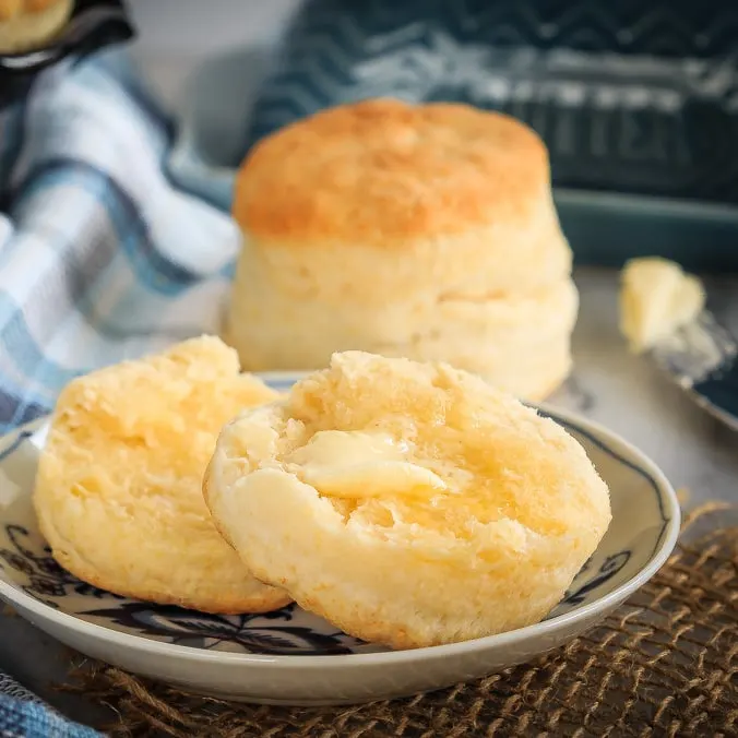 These homemade cream biscuits use only 4 ingredients, take just minutes to mix up, and result in wonderfully flaky homemade biscuits you will love! The perfect easy side dish for any meal, or even for breakfast warmed up with some jam!