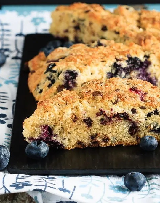 Blueberry Chocolate Chip Scones - Easy to make, light and fluffy blueberry chocolate chip scones sprinkled with coarse sugar - the perfect breakfast treat!