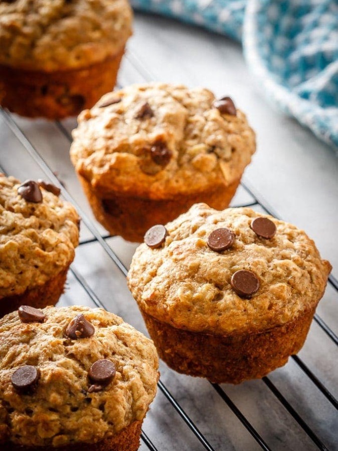 These chocolate chip banana oatmeal muffins are super easy to make. Filled with oats, whole wheat flour, and bananas - they're healthy enough for breakfast!