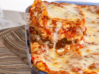 Homemade lasagna is one of my family's favourite meals. A thick and chunky meat sauce and lots of cheese, layered with tender pasta - perfect comfort food!