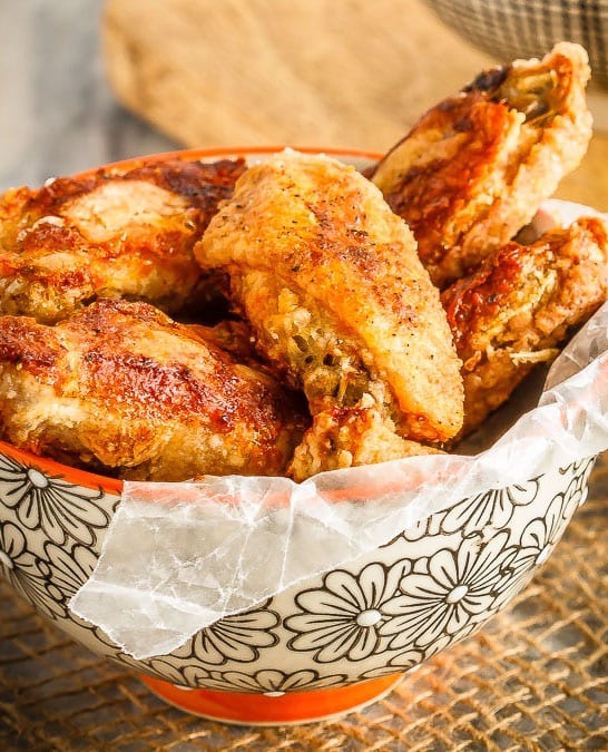 These oven baked wings are super crispy and so easy to make. Toss them with your favourite sauce for perfect wings that are baked instead of fried!