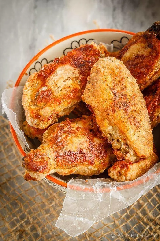 These oven baked wings are super crispy and so easy to make. Toss them with your favourite sauce for perfect wings that are baked instead of fried!