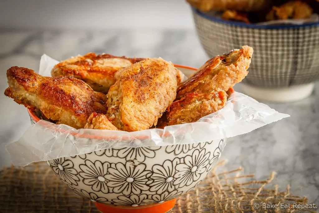 These oven baked wings are super crispy and so easy to make. Toss them with your favourite sauce for perfect wings that are baked instead of fried!