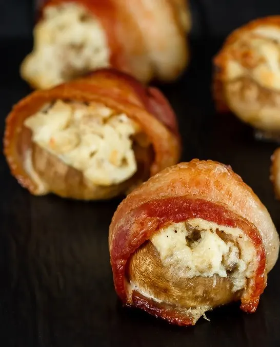 An easy and delicious appetizer that can be made ahead of time. These creamy, cheesy, crab stuffed mushrooms are wrapped in bacon for the perfect appetizer!