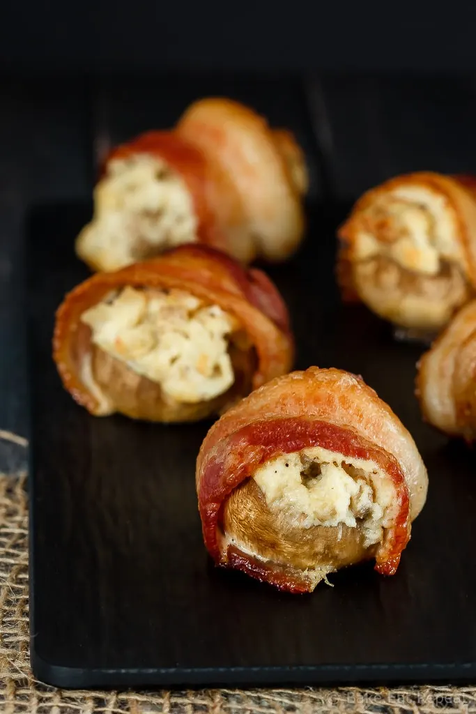 An easy and delicious appetizer that can be made ahead of time. These creamy, cheesy, crab stuffed mushrooms are wrapped in bacon for the perfect appetizer!