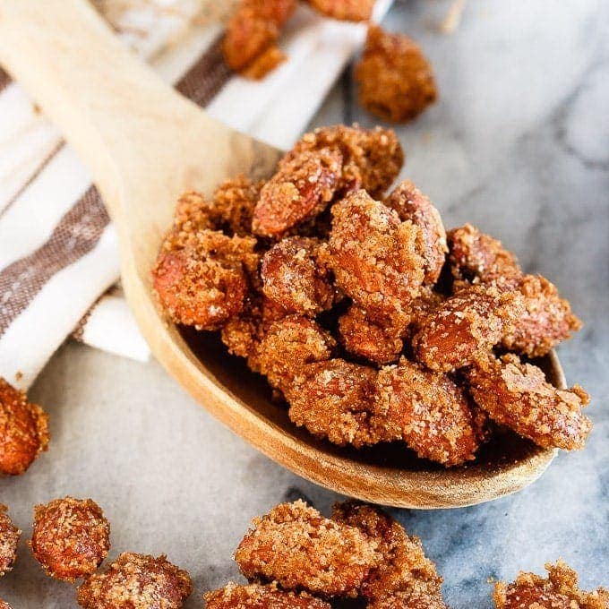 Cinnamon Sugar Almonds - Easy cinnamon sugar almonds. 5 minutes of prep time plus one hour of baking equals completely addictive, crunchy, candied almonds. The best kind of snack!