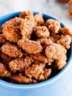 Cinnamon Sugar Almonds - Easy cinnamon sugar almonds. 5 minutes of prep time plus one hour of baking equals completely addictive, crunchy, candied almonds. The best kind of snack!