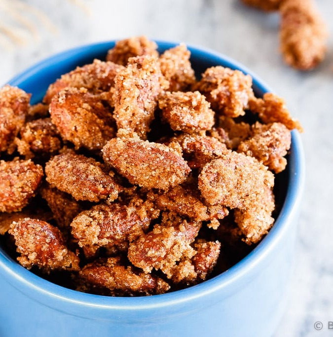 Cinnamon Sugar Almonds - Easy cinnamon sugar almonds. 5 minutes of prep time plus one hour of baking equals completely addictive, crunchy, candied almonds. The best kind of snack!