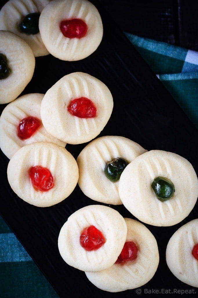 These light and sweet whipped shortbread cookies, with a cherry on top, are so quick and easy to make. Christmas cookie perfection.