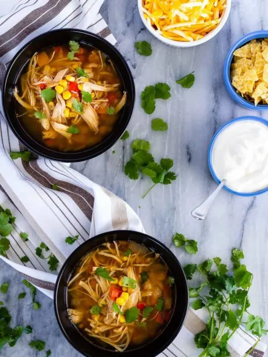 Instant Pot or slow cooker chicken taco soup - the easiest soup to toss together, and so full of flavour. The whole family will love it!