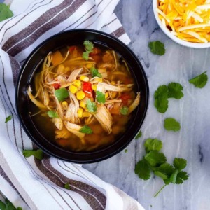 Instant Pot or slow cooker chicken taco soup - the easiest soup to toss together, and so full of flavour. The whole family will love it!