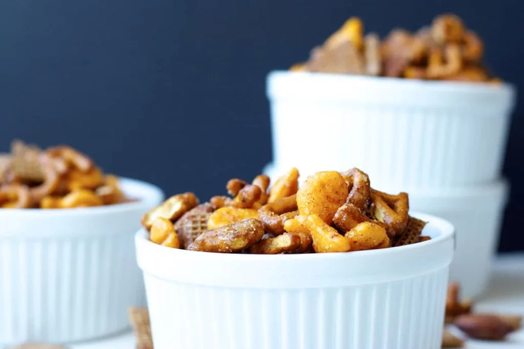 Sweet and Spicy Snack Mix - This snack mix is quick and easy to mix up, with an addictive sweet and spicy coating. Perfect to pack in a lunch, or just eat up straight off the pan!