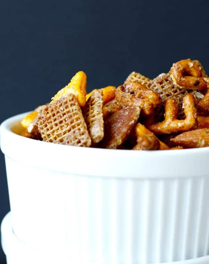 Sweet and Spicy Snack Mix - This snack mix is quick and easy to mix up, with an addictive sweet and spicy coating. Perfect to pack in a lunch, or just eat up straight off the pan!