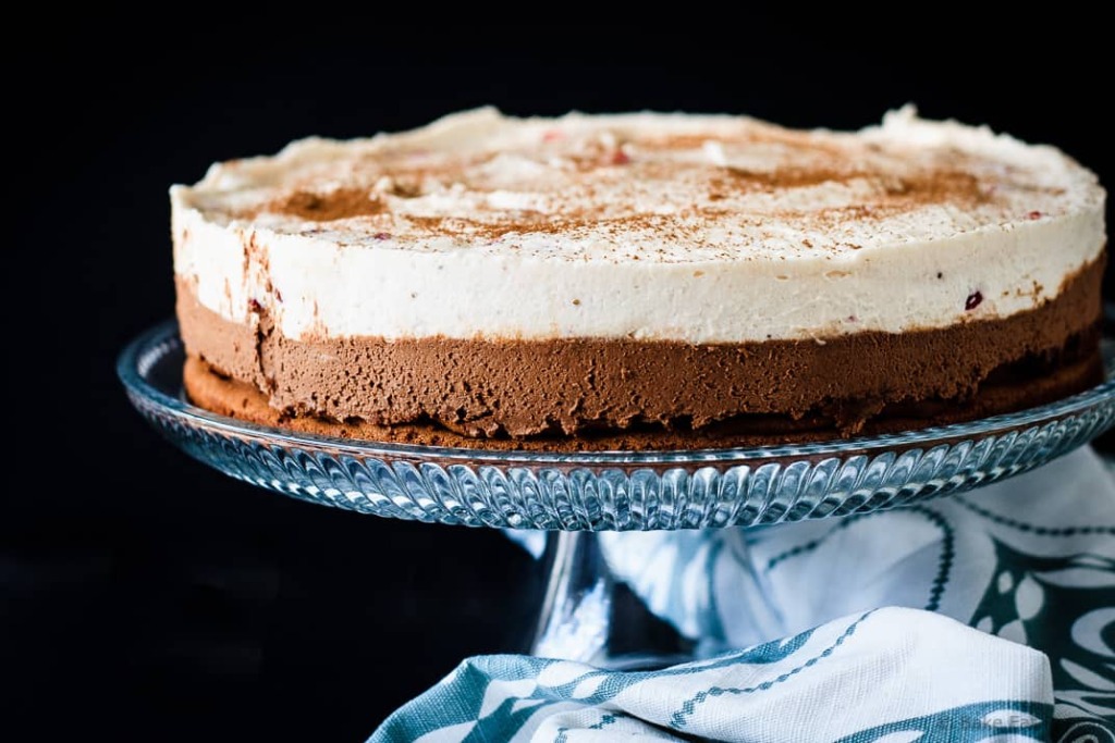 Chocolate Mousse Cake - A decadent triple chocolate strawberry mousse cake that is perfect for a special occasion. Flourless chocolate cake, dark chocolate mousse, and a white chocolate strawberry mousse - a chocolate lover's dream!