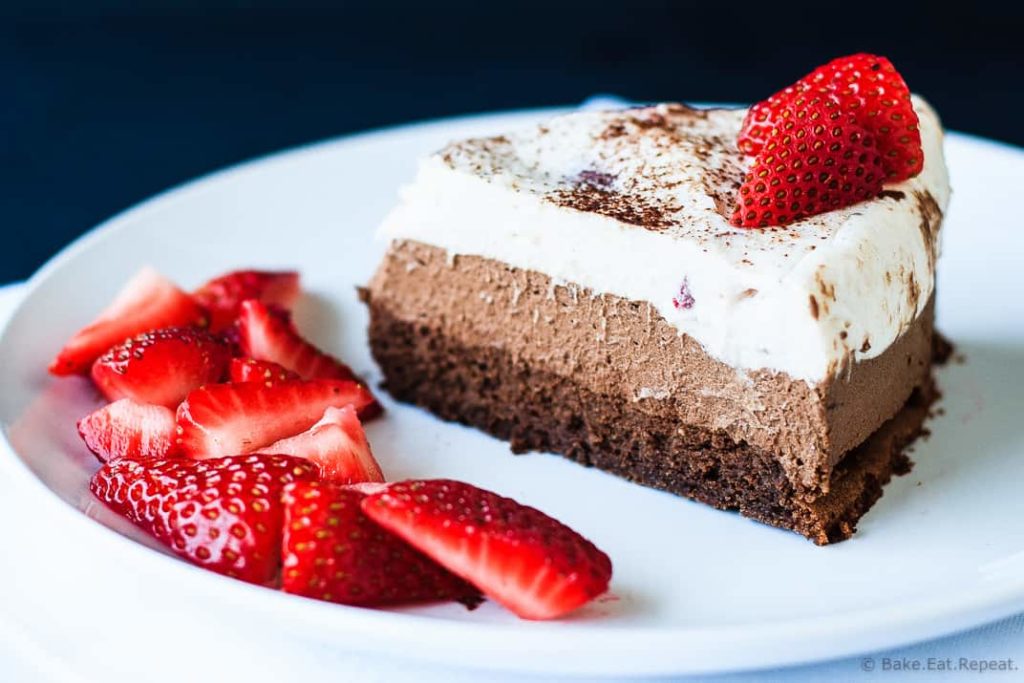 Chocolate Mousse Cake - A decadent triple chocolate strawberry mousse cake that is perfect for a special occasion.  Flourless chocolate cake, dark chocolate mousse, and a white chocolate strawberry mousse - a chocolate lover's dream!