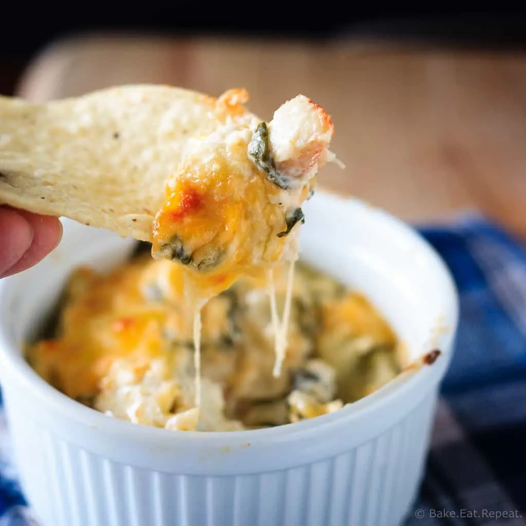 Hot Crab, Spinach and Artichoke Dip - Easy hot baked crab, spinach and artichoke dip that you will not be able to stop eating! Having a party? Or a Friday night? You need this cheesy dip!