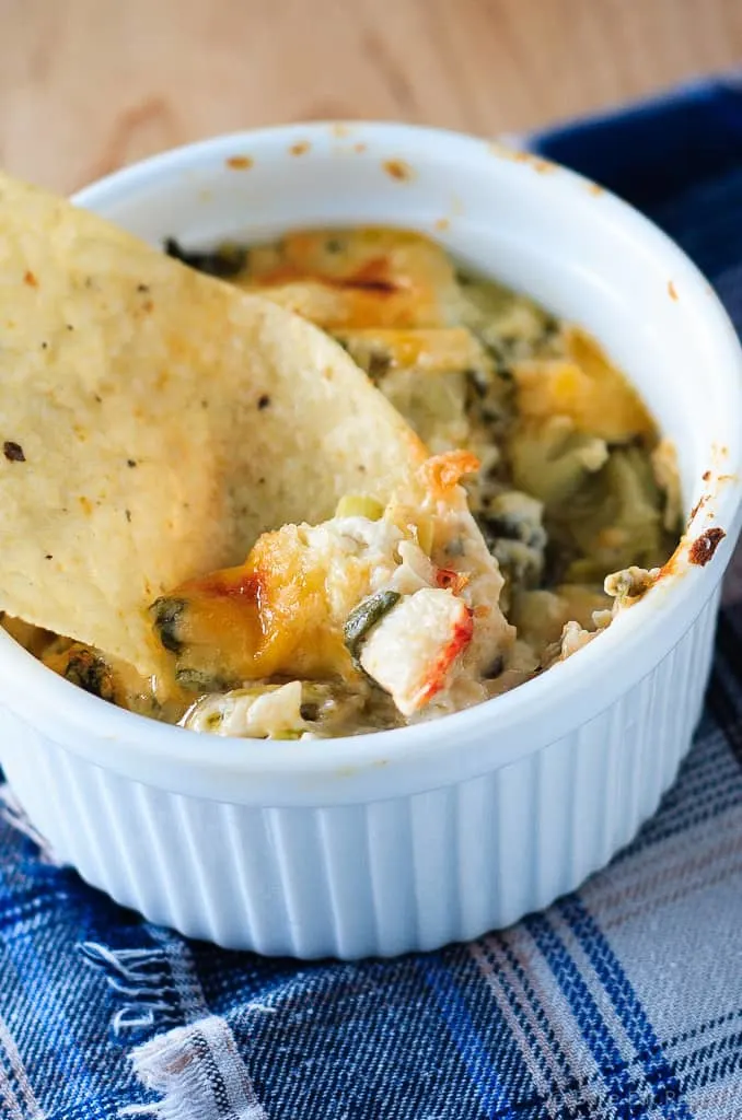 Hot Crab, Spinach and Artichoke Dip - Easy hot baked crab, spinach and artichoke dip that you will not be able to stop eating! Having a party? Or a Friday night? You need this cheesy dip!