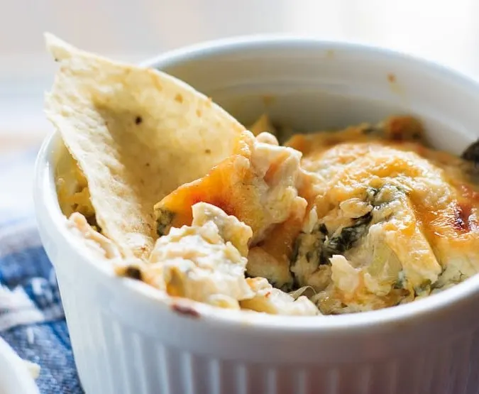 Hot Crab, Spinach and Artichoke Dip - Easy hot baked crab, spinach and artichoke dip that you will not be able to stop eating! Having a party? Or a Friday night? You need this cheesy dip!