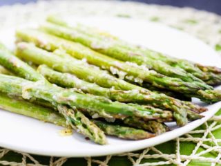 Lemon Roasted Asparagus - This quick and easy roasted lemon parmesan asparagus is the perfect way to brighten up this tasty spring vegetable! Plus, it only takes 15 minutes to get on the table!