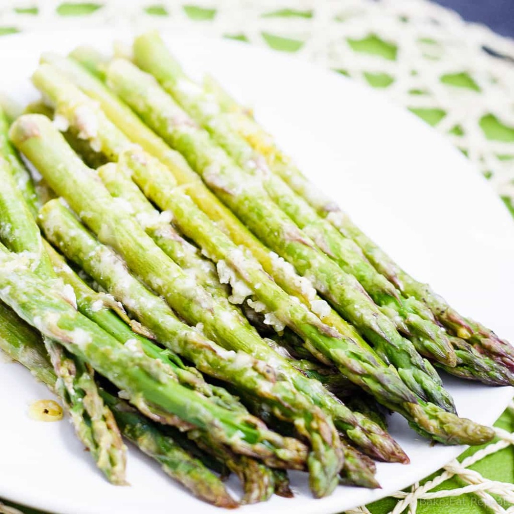 Lemon Roasted Asparagus - This quick and easy roasted lemon parmesan asparagus is the perfect way to brighten up this tasty spring vegetable! Plus, it only takes 15 minutes to get on the table!