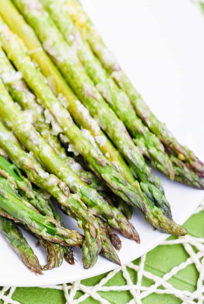 Lemon Roasted Asparagus - This quick and easy roasted lemon parmesan asparagus is the perfect way to brighten up this tasty spring vegetable! Plus, it only takes 15 minutes to get on the table!