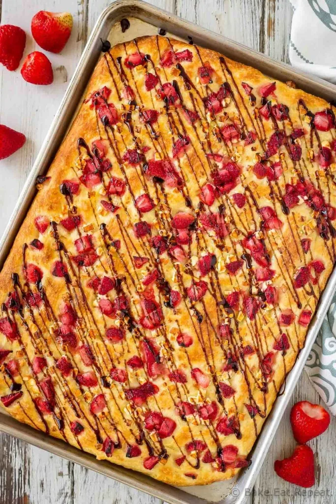 This easy focaccia with strawberries and feta is topped with balsamic glaze and makes the perfect side dish or light lunch. And the kids went crazy for it!