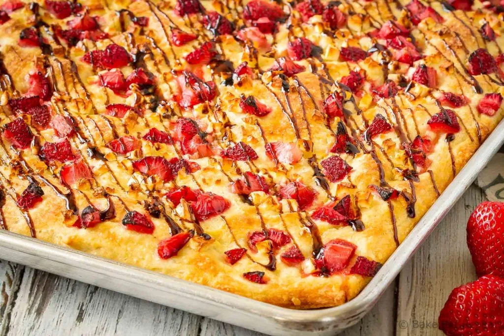 This easy focaccia with strawberries and feta is topped with balsamic glaze and makes the perfect side dish or light lunch. And the kids went crazy for it!