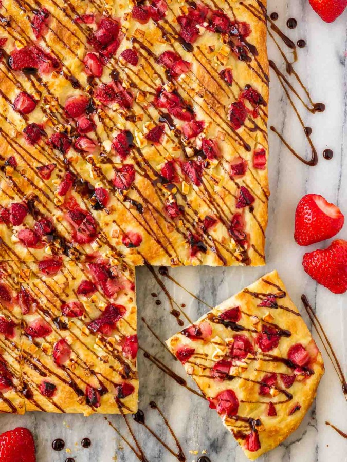 This easy focaccia with strawberries and feta is topped with balsamic glaze and makes the perfect side dish or light lunch. And the kids went crazy for it!