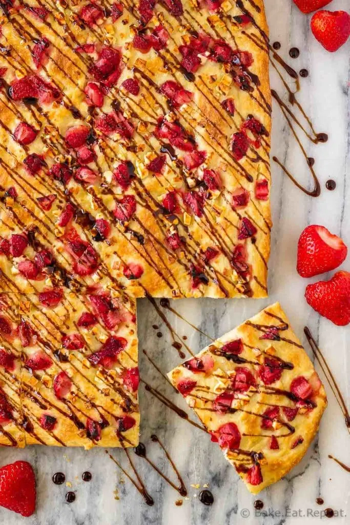 This easy focaccia with strawberries and feta is topped with balsamic glaze and makes the perfect side dish or light lunch. And the kids went crazy for it!
