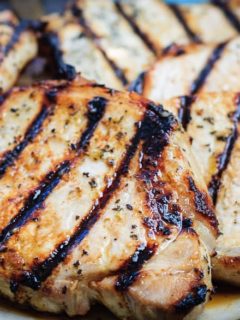 Honey Lime Grilled Pork Chops - Tender and juicy honey lime marinated pork chops that are quick and easy to grill up for the perfect summer meal!