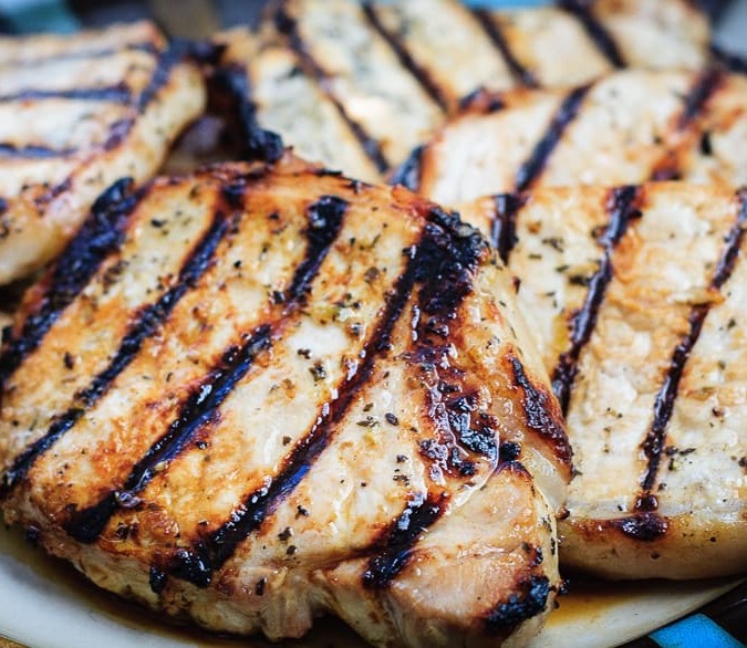 Honey Lime Grilled Pork Chops - Tender and juicy honey lime marinated pork chops that are quick and easy to grill up for the perfect summer meal!