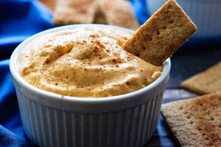 Pumpkin Pie Dip - A quick and easy pumpkin pie dip that tastes just like pumpkin pie, but in dip form! Serve it with graham crackers and fruit for a perfect light dessert!