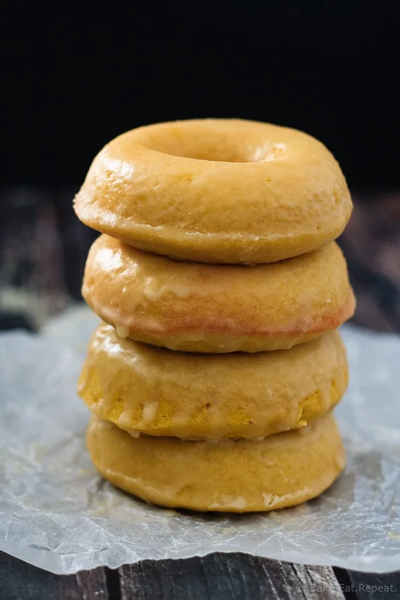 Baked Pumpkin Spice Doughnuts - Quick and easy baked pumpkin spice doughnuts (or doughnut holes!) coated with either a sweet maple glaze or cinnamon sugar. Either way - they're absolutely amazing!