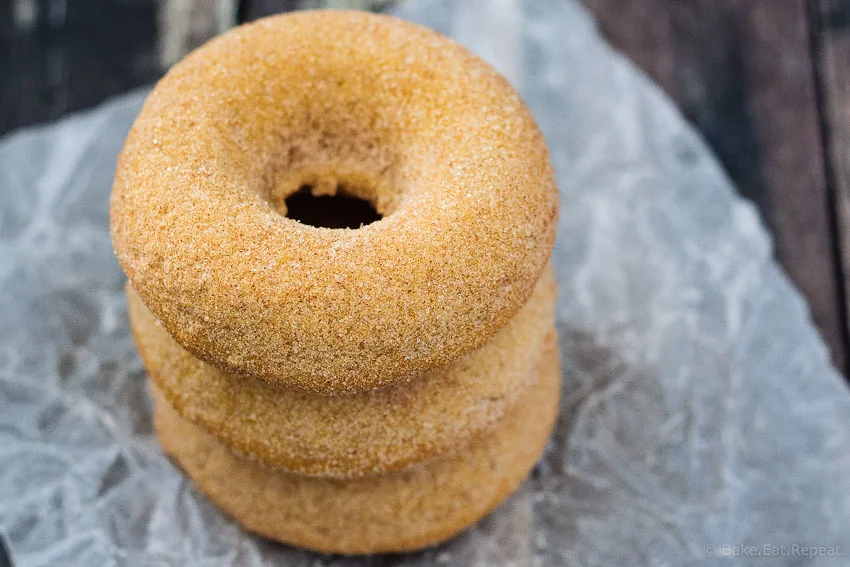 Baked Pumpkin Spice Doughnuts - Quick and easy baked pumpkin spice doughnuts (or doughnut holes!) coated with either a sweet maple glaze or cinnamon sugar. Either way - they're absolutely amazing!