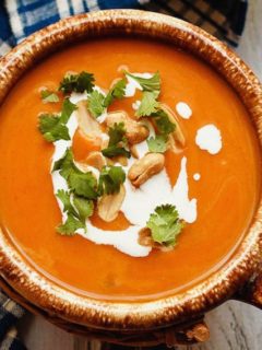 This easy to make, slow cooker Thai pumpkin soup is a bit spicy, a bit creamy, and absolutely amazing. The perfect meal for a cold fall day!