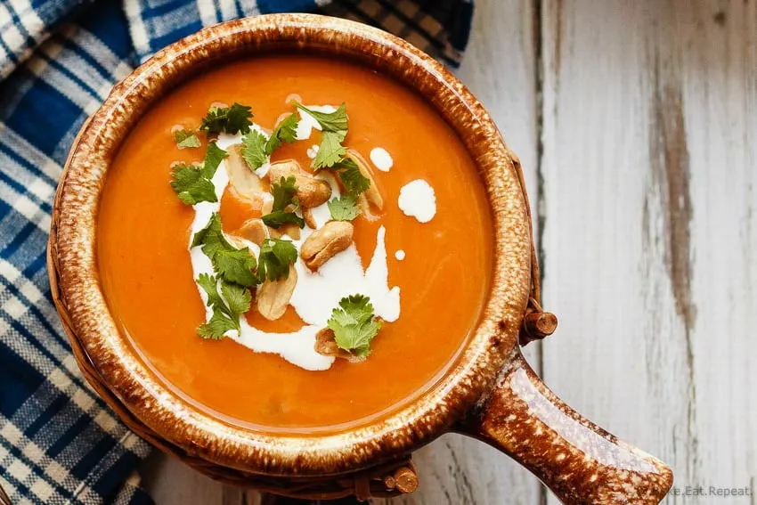 Slow Cooker Thai Pumpkin Soup - Easy to make slow cooker Thai pumpkin soup - a bit spicy, a bit creamy, a whole lot of amazing. The perfect meal for a cold fall day!