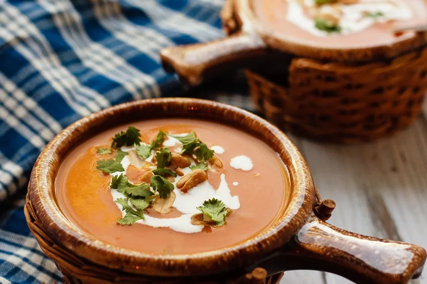 Slow Cooker Thai Pumpkin Soup - Easy to make slow cooker Thai pumpkin soup - a bit spicy, a bit creamy, a whole lot of amazing. The perfect meal for a cold fall day!