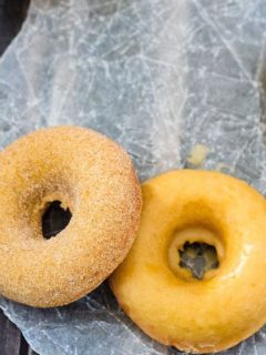 Baked Pumpkin Spice Doughnuts - Quick and easy baked pumpkin spice doughnuts (or doughnut holes!) coated with either a sweet maple glaze or cinnamon sugar. Either way - they're absolutely amazing!