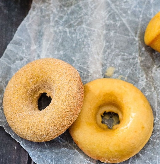 Baked Pumpkin Spice Doughnuts - Quick and easy baked pumpkin spice doughnuts (or doughnut holes!) coated with either a sweet maple glaze or cinnamon sugar. Either way - they're absolutely amazing!