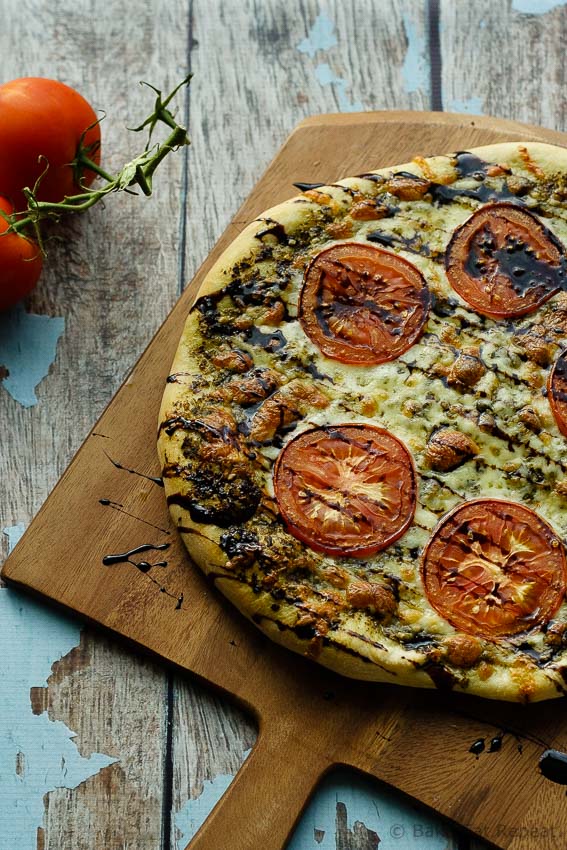 Caprese Pizza - Easy caprese pizza with pesto, mozzarella and tomatoes, and drizzled with balsamic glaze.