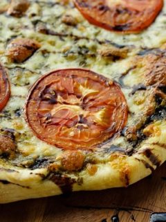 Caprese Pizza - Easy caprese pizza with pesto, mozzarella and tomatoes, and drizzled with balsamic glaze.