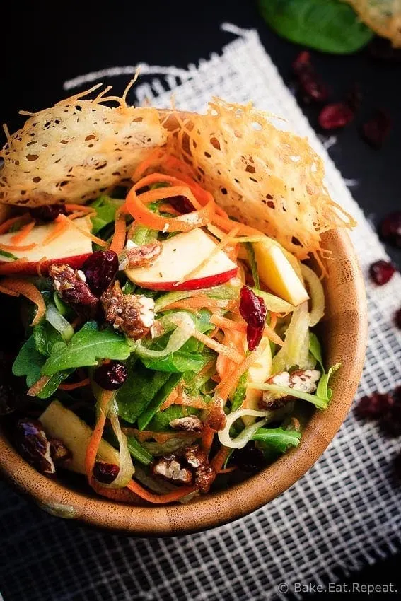 Carrot, Apple and Cucumber Salad - Amazing carrot, cucumber and apple salad with candied pecans and asiago crisps, all drizzled with a red wine vinaigrette.