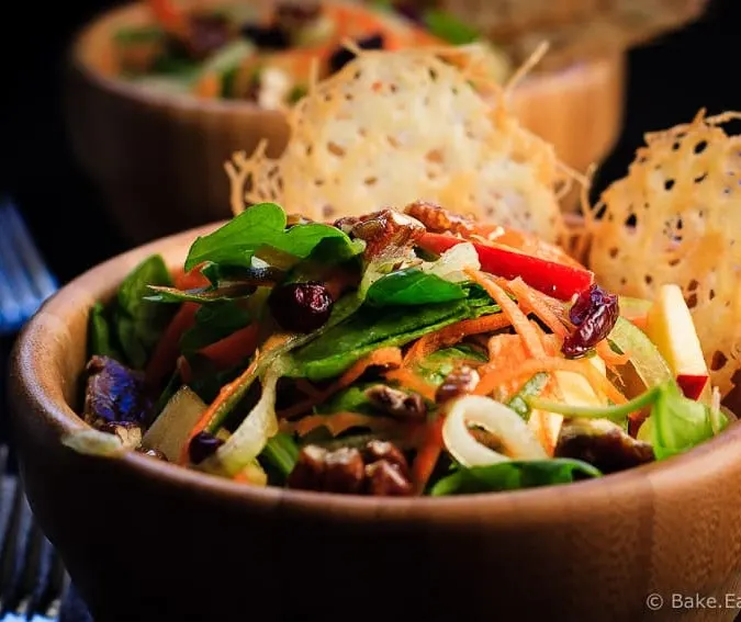 Carrot, Apple and Cucumber Salad - Amazing carrot, apple and cucumber salad with candied pecans and asiago crisps, all drizzled with a red wine vinaigrette.