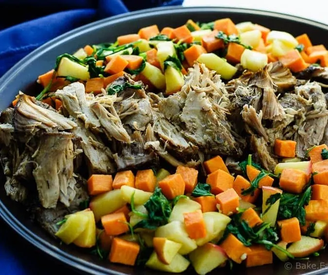 Slow Cooker Pork Roast - An easy slow cooker pork roast with maple roasted sweet potatoes, apples and spinach. The perfect fall meal!