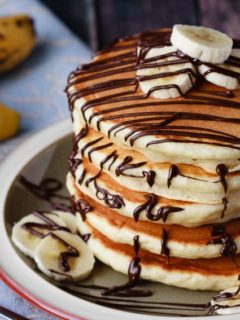 Banana Pancakes - Easy banana pancakes that mix up quickly and are a fantastic change from the usual buttermilk pancakes. The whole family will love these for breakfast!